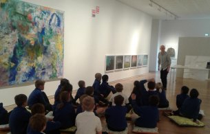 Curator Martin Drury previewing SurprEYES! exhibition with local school children