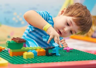 Child playing with lego