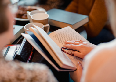 Members of a bookclub reading books