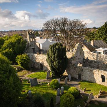 arial view of the ruins of St. Begnet's Church in Dalkey with the graveyard in the foreground